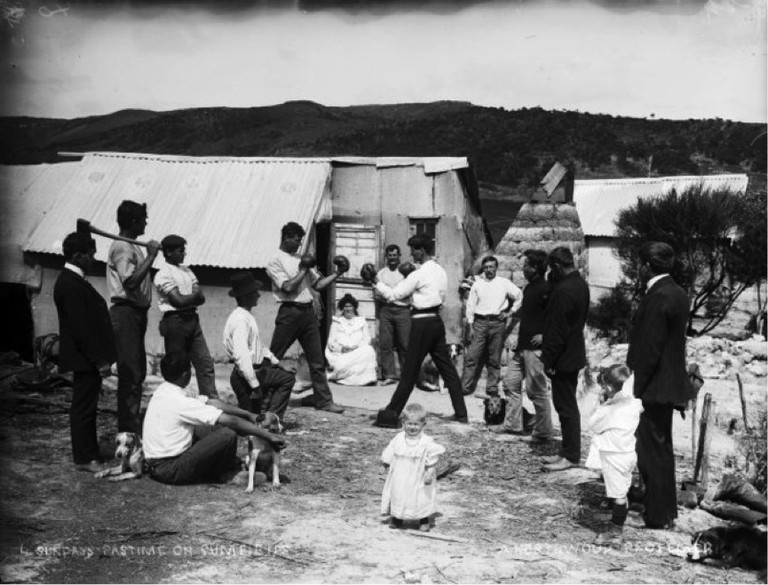Group watching a boxing match on a gum field. Northwood brothers: Photographs of Northland. Ref: 1/1-011205-G. Alexander Turnbull Library, Wellington, New Zealand. http://natlib.govt.nz/records/22795592. Permission of the Alexander Turnbull Library, Wellington, New Zealand, must be obtained before any reuse of this image.