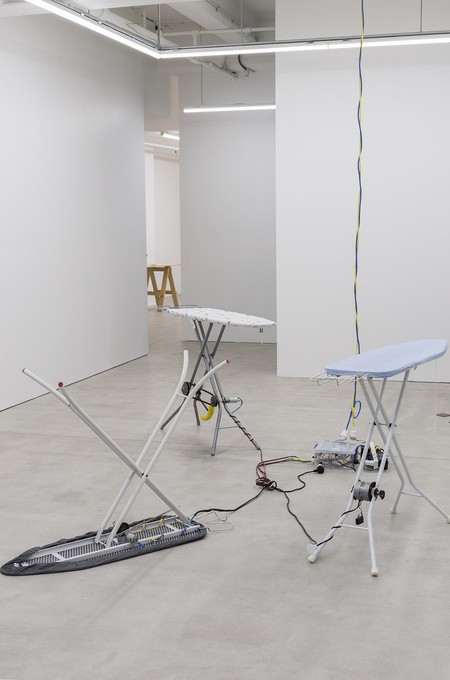 David Ed Cooper, New Bruxism, 2019, ironing boards, dc/ac motors, transmission, banana, cable, shackle bolt, tupperware, arduino, 5v relay, motor speed controllers, power supply. Image courtesy of Cheska Brown.