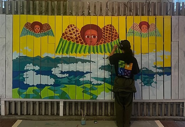 Keelin Bell painting Enjoy x Mother of Coffee mural, 2025.