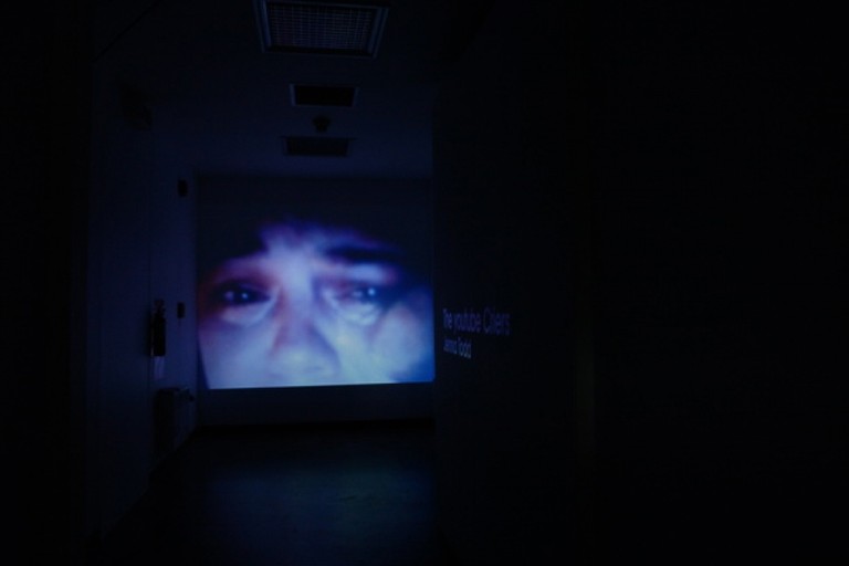 Fig 13. Jenna Todd, The youtube Criers, digital video, full wall projection, 2007. © Blue Oyster Gallery