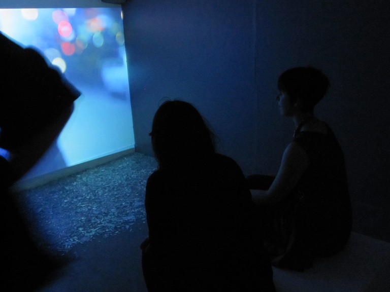 Fig 8. Phoebe Lysbeth Kay Mackenzie, When I Grow Up: Walk, looped video, glass, full wall projection, 2012. © Blue Oyster Gallery