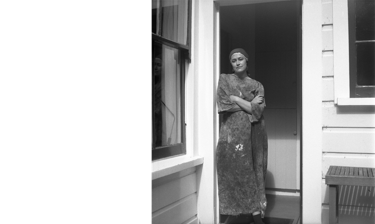 Eleanor in the back door to the garden at the Rita Angus Cottage, 2022. Image courtesy of Tom Denize