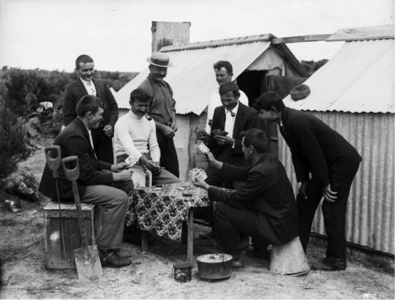 Gum diggers playing cards in camp. Northwood brothers: Photographs of Northland. Ref: 1/1-011230-G. Alexander Turnbull Library, Wellington, New Zealand. http://natlib.govt.nz/records/23226852. Permission of the Alexander Turnbull Library, Wellington, New Zealand, must be obtained before any reuse of this image.