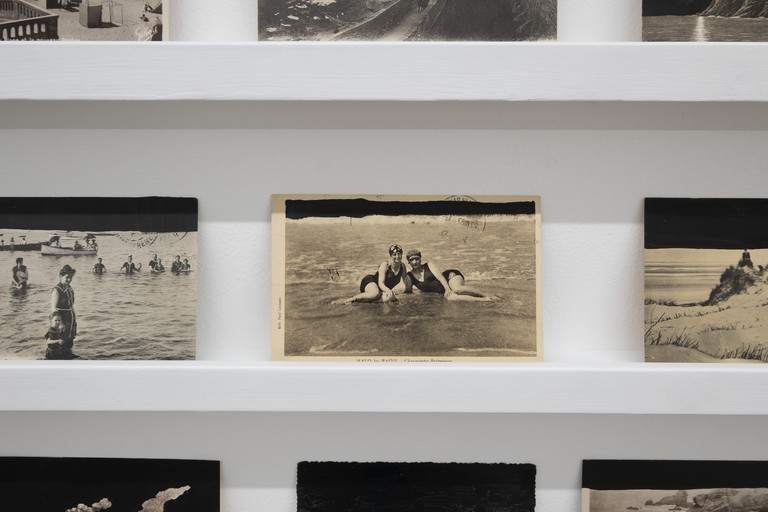 Sharon Kivland, Mes horizons, 2013–ongoing, detail view. Found seascape postcards, Indian ink. Photo by Samson Dell.