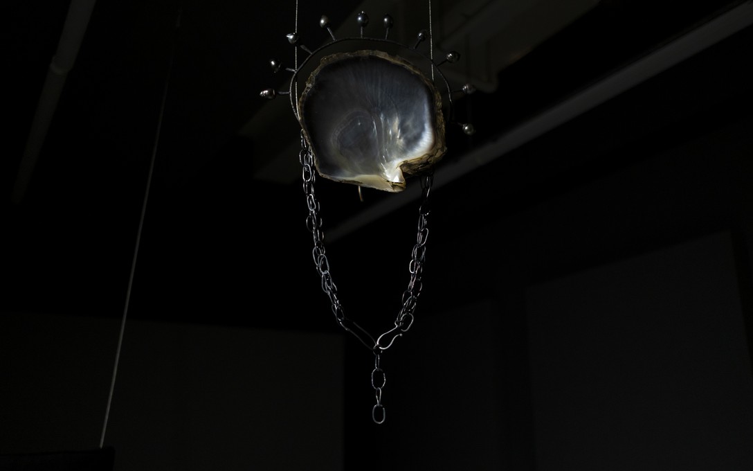 Te Māreikura Whakataka-Brightwell, Luctus Maris/The Mourning of the Sea, Tahitian baroque pearls, silver chains, copper halo and mount, vintage wild Tahitian mother of pearl (an heirloom that belonged to the artist’s grandmother), 2026. Fabrication by Dorthe Kristensen. Photo by Samson Dell.