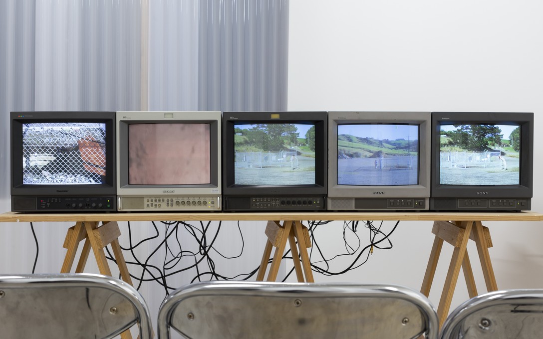 Elvis Booth-Claveria, Wells: Gas, Wishing, Tear and Fare, 2025. Multi-channel video installation. Filmed at the decomissioned Pōuri A well site, Tikorangi. Detail view. Courtesy of Cheska Brown.