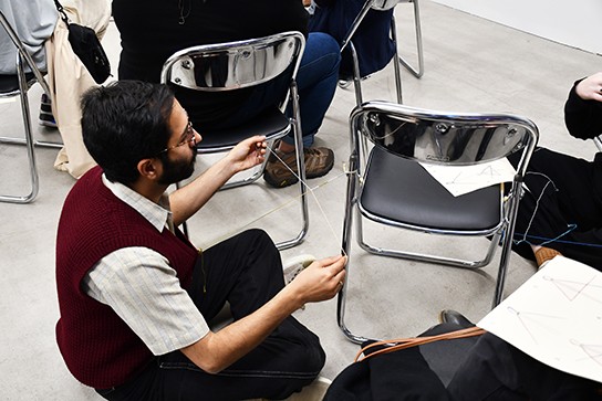 Participant utilising gallery seating. Artist talk and friendship bracelets: Megan Brady and Ed Ritchie, 15 May 2021.