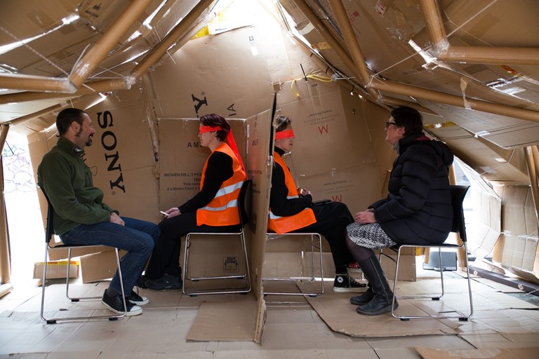 Audrey Baldwin, Oscar Bannan, Bridget Harris, Neil MacLeod, Annemieke Montagne, Patricia Parkin, Jennifer Katherine Shields, CARDBOARD CONFESSIONAL, 2016. 12:30 p.m. – late afternoon, 91 Hereford St (Spark Park), Christchurch. 