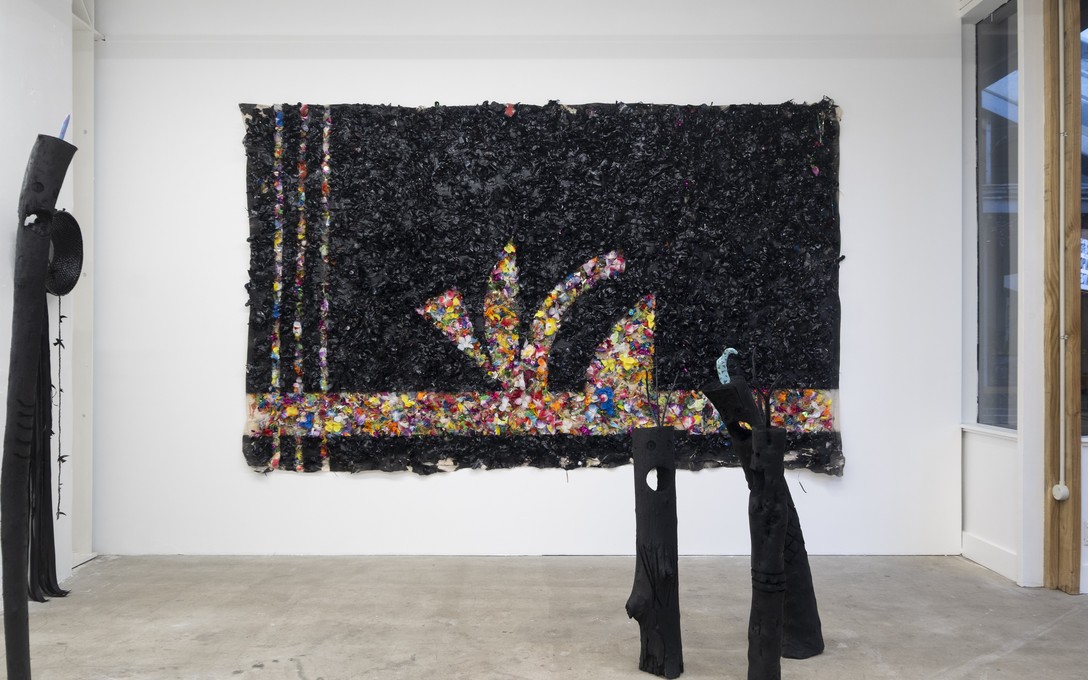 Telly Tuita, The Great Land of Oz (mixed media diptych), 2023 and Screaming Idol series (driftwood & acrylic paint), 2026. Photo by Samson Dell.