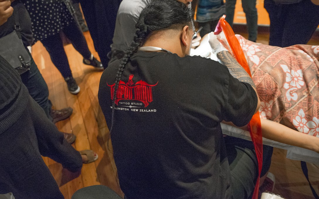 Andy Tauafiafi and Michelle Healey, TYPEFACE: Live Tattoo Session, opening night, 2018. Image courtesy of Shaun Matthews.