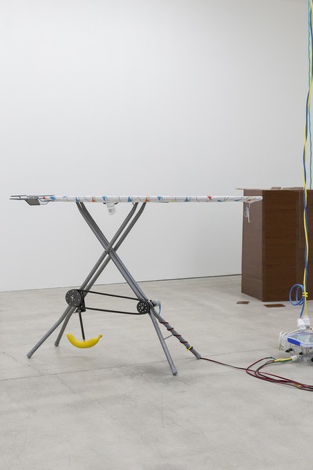 David Ed Cooper, New Bruxism, 2019, detail, ironing boards, dc/ac motors, transmission, banana, cable, shackle bolt, tupperware, arduino, 5v relay, motor speed controllers, power supply. Image courtesy of Cheska Brown.
