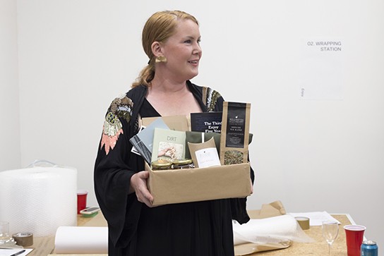 Treasurer Kate Ricketts holds a fabulous raffle prize bundle, Buy Enjoy, 17 December 2020.