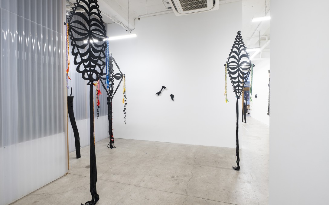 Telly Tuita, Mobiles #1 Tokelau Feletoa, #2 Tokelau Feletoa, #3 Kalou (MDF, spray paint, ribbons, found shells and toys), 2026. Photo by Samson Dell.