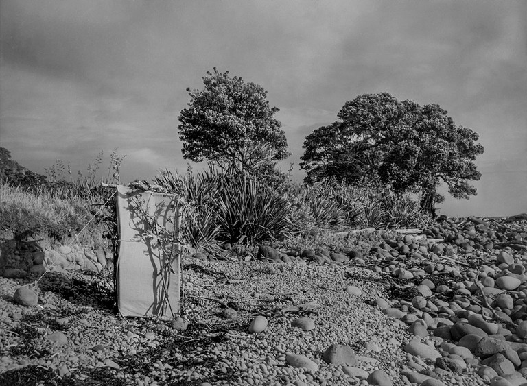 Kenneth Bigwood, ‘Little Barrier Island. Bird Life. Ground Hide erected for photographic purposes at a Kingfisher’s nest in low bank along the sea front.’ [AAQT-6539-A20718], Black and white photograph, Dimensions variable, 1949, Copyright Archives New Zealand.