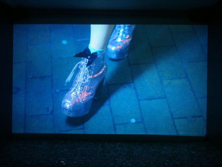 Fig 7. Phoebe Lysbeth Kay Mackenzie, When I Grow Up: Walk, looped video, glass, full wall projection, 2012. © Blue Oyster Gallery