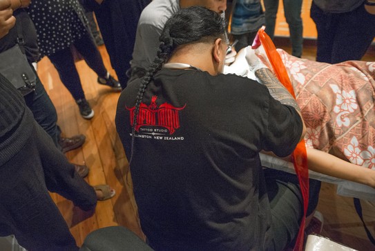 Andy Tauafiafi and Michelle Healey, TYPEFACE: Live Tattoo Session, 2018. Image courtesy of Shaun Matthews and Enjoy Public Art Gallery.